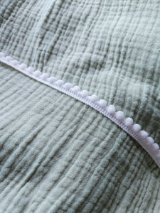 Deluxe pompom swaddle