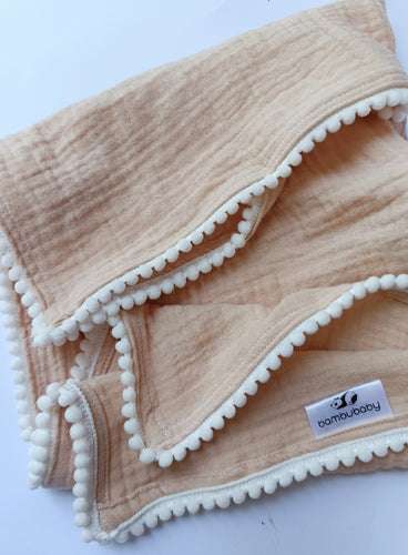 Deluxe pompom swaddle