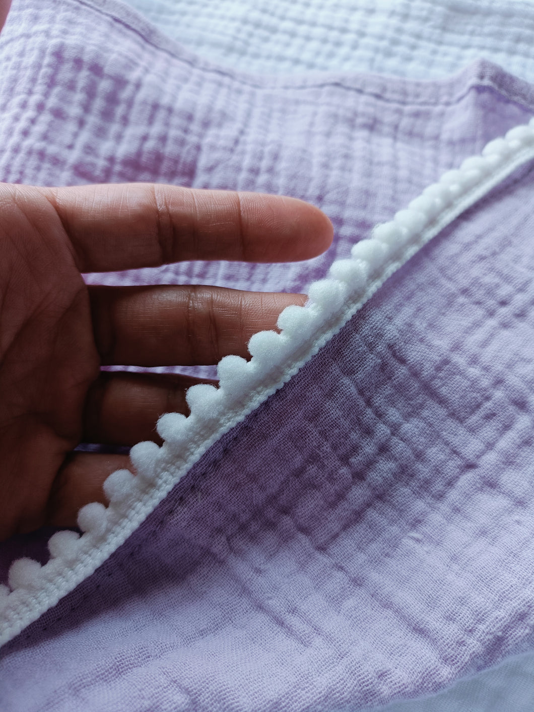 Deluxe pompom swaddle